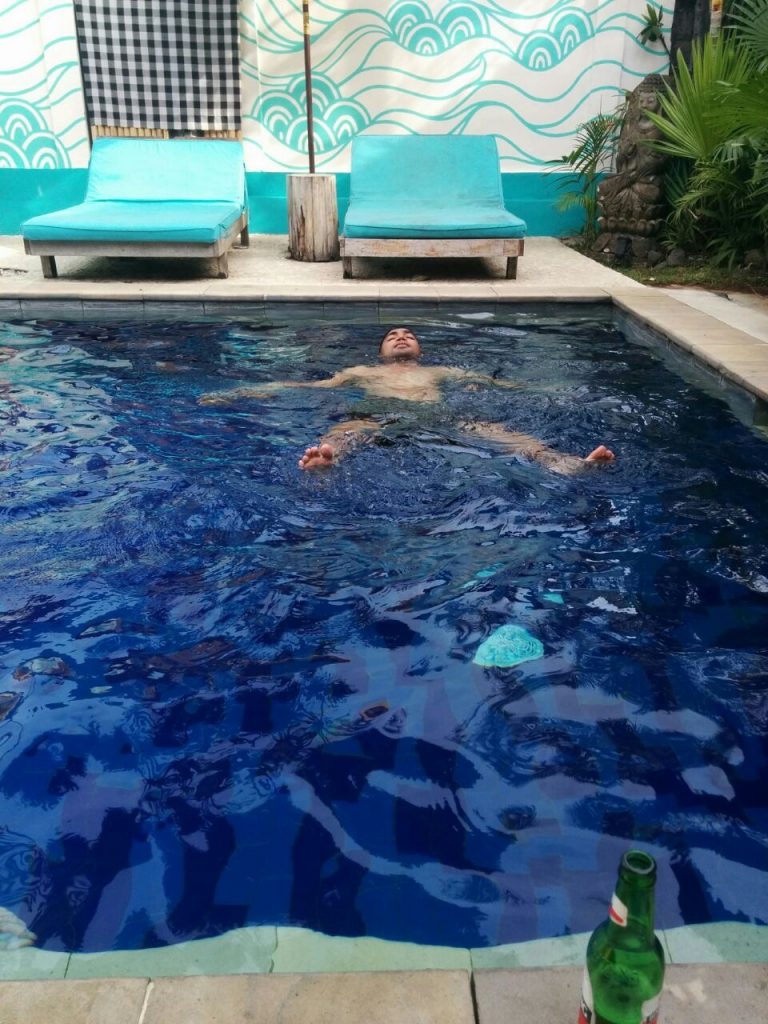 H. at the plunge pool floating with a Bintang. It's a chill life at the Chillhouse.