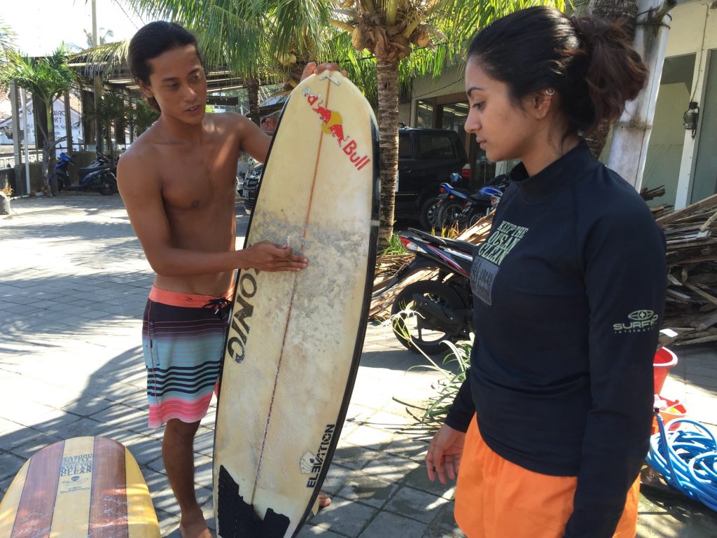 Waxing your board before going to surf is important to avoid slipping on it.